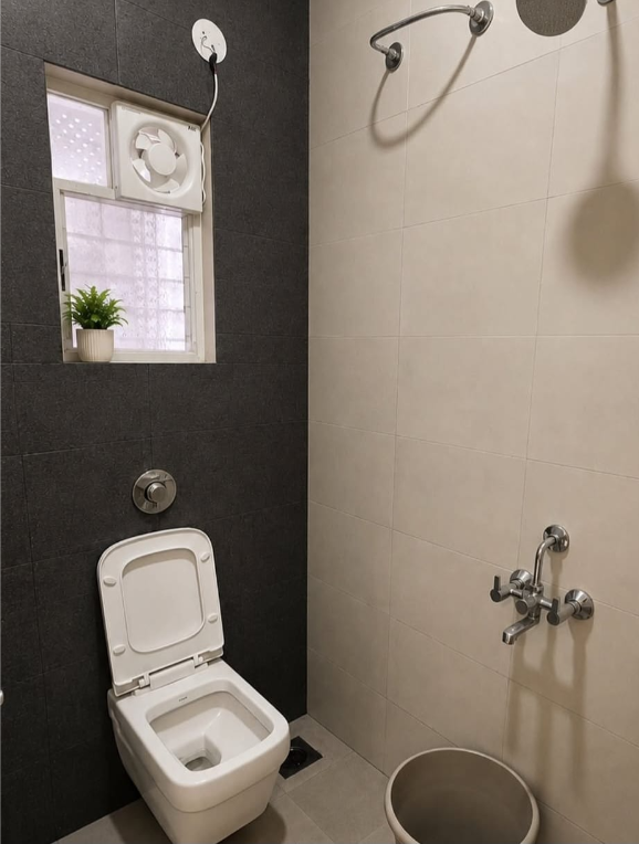 Clean bathroom with shower and western toilet